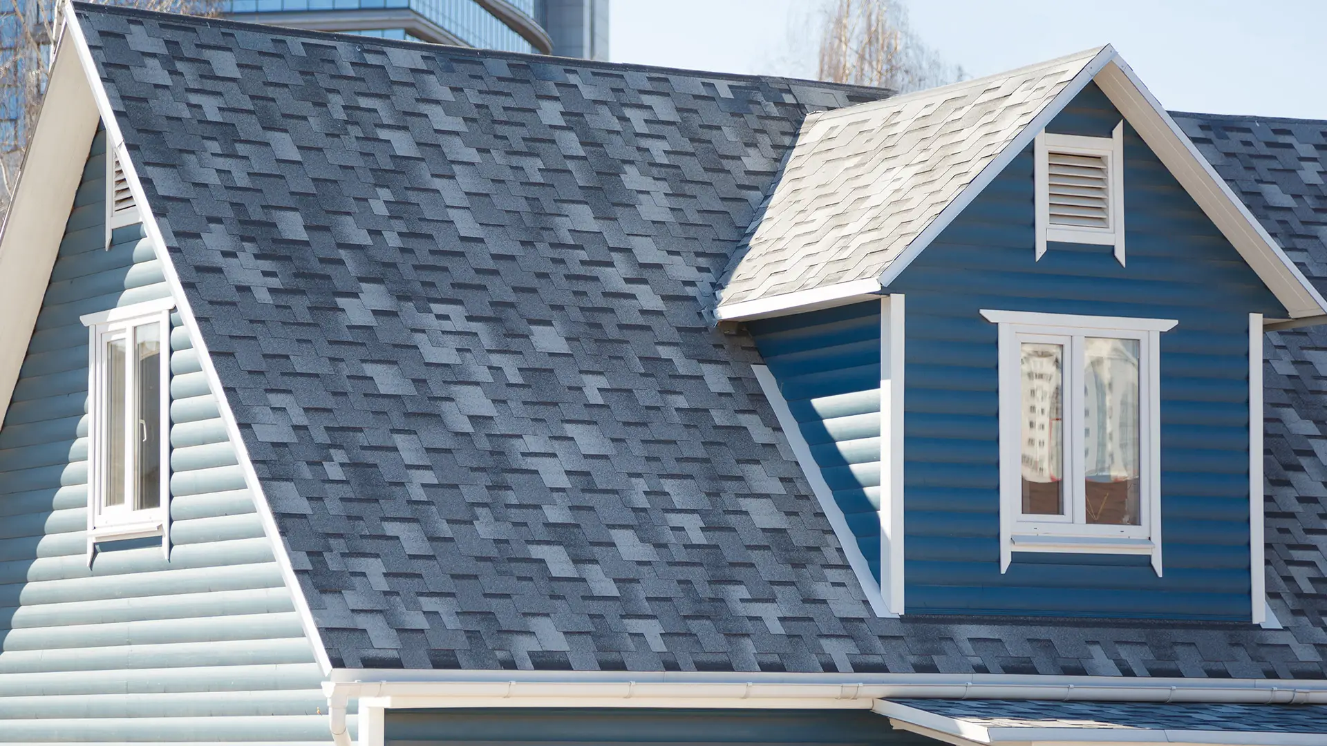 Blue house with grey shingles.