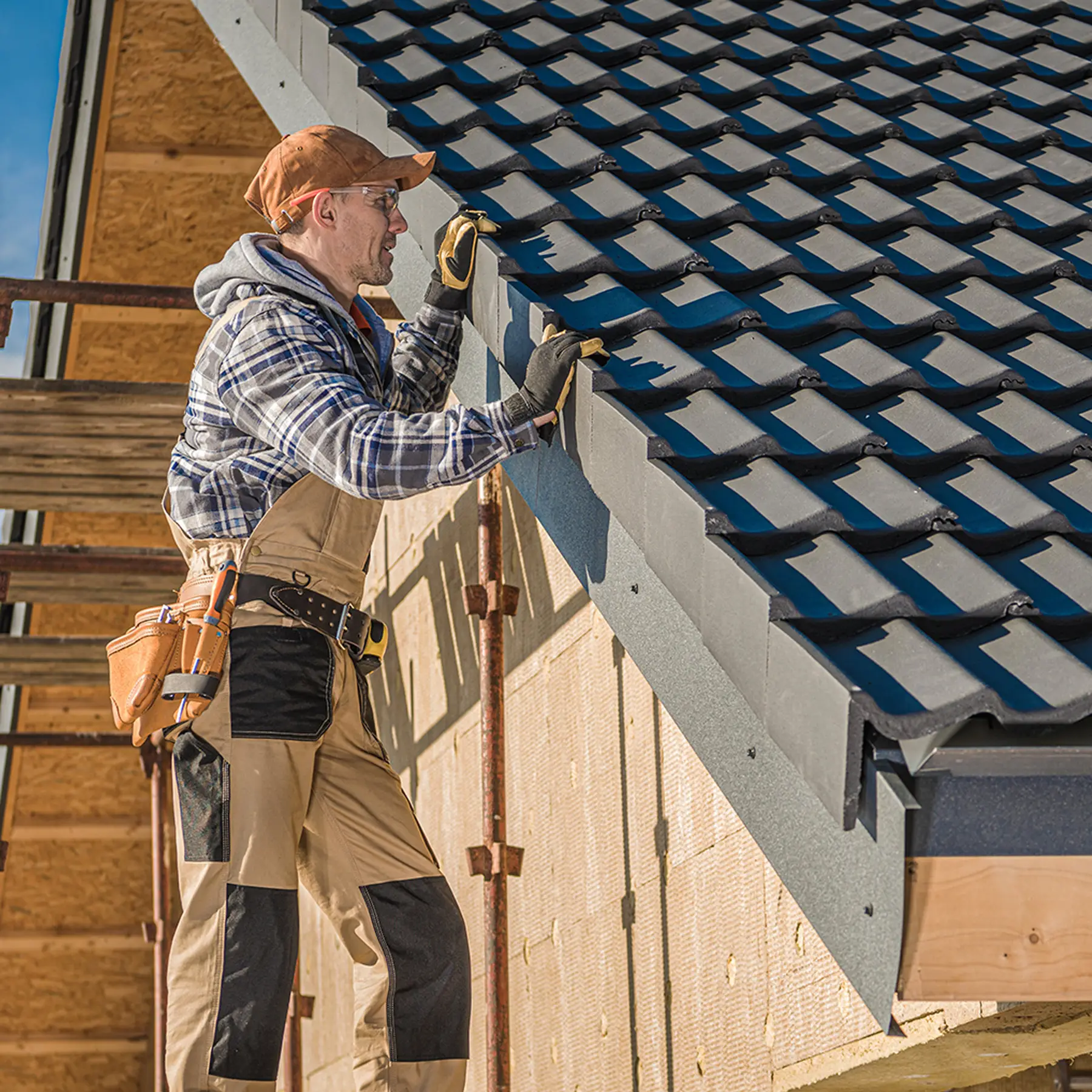 Worker examining a roof.