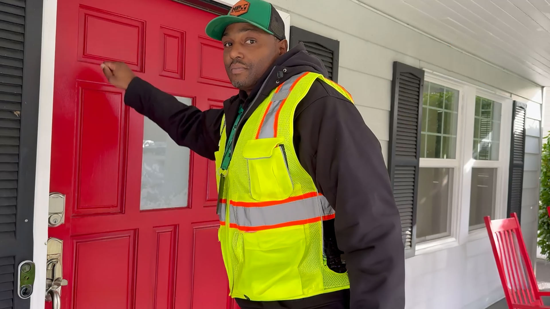 Brand Ambassador at a home door.