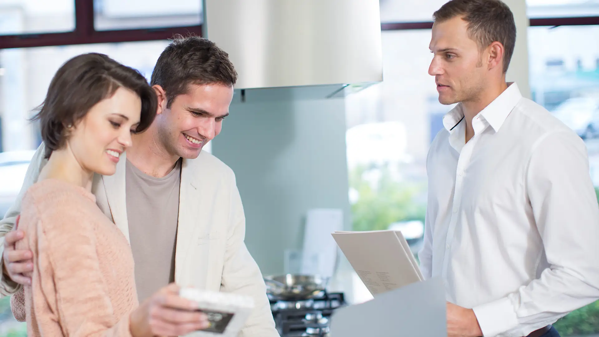 Homeowner couple meets with a company representative.